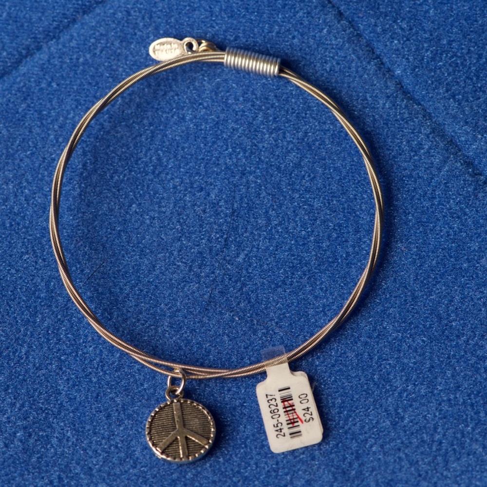 Guitar string bracelet with peace charm